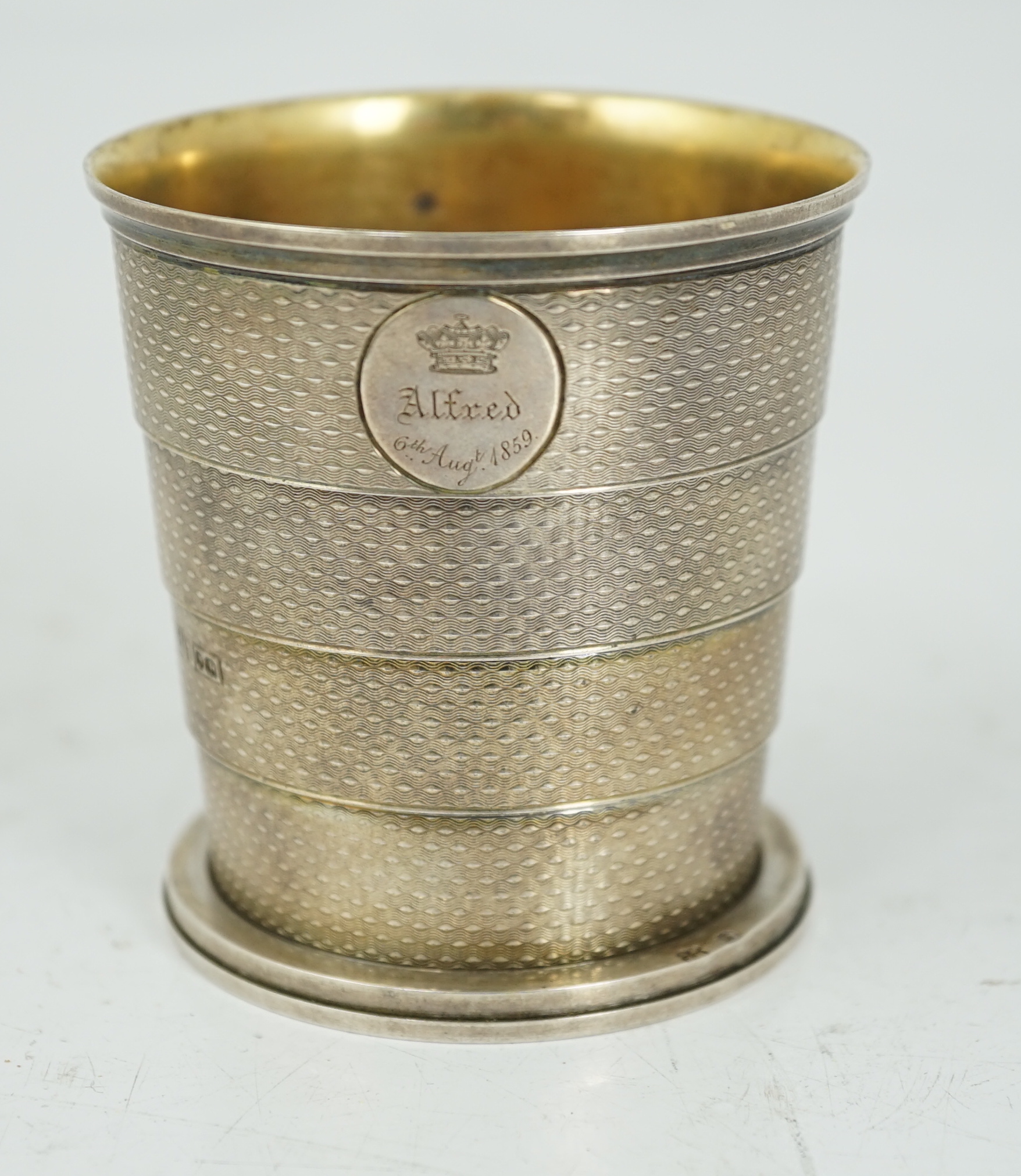 ROYAL INTEREST: A cased Victorian textured silver collapsible travelling cup, by Brownett & Rose, with later engraved inscription, 'Presented By Her Royal & Imperial Highness The Duchess of Saxe Coburg & Gotha Duchess of